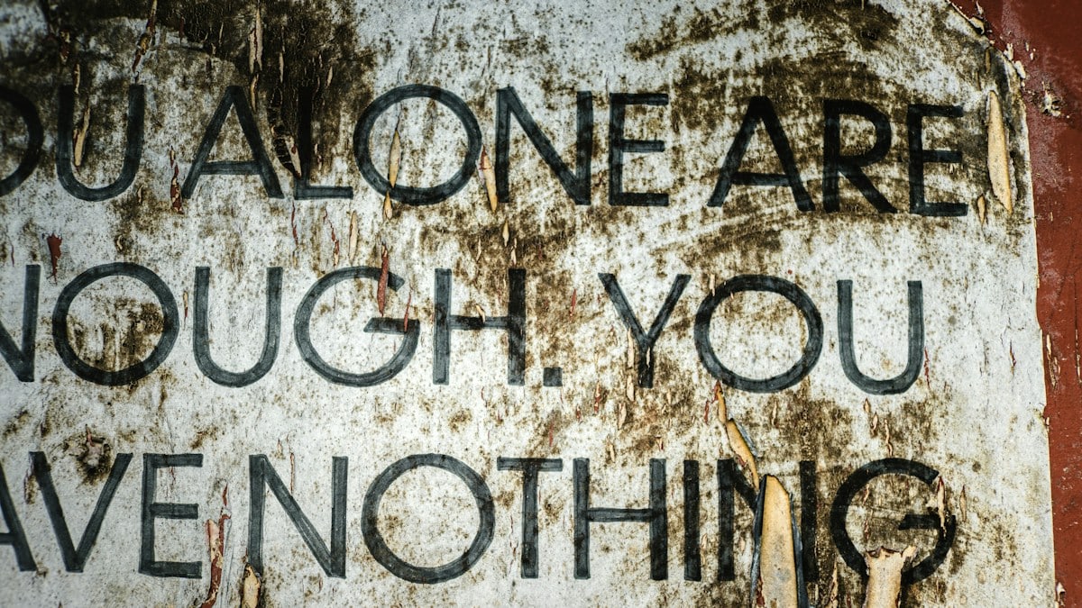 Torn poster with text about self-worth